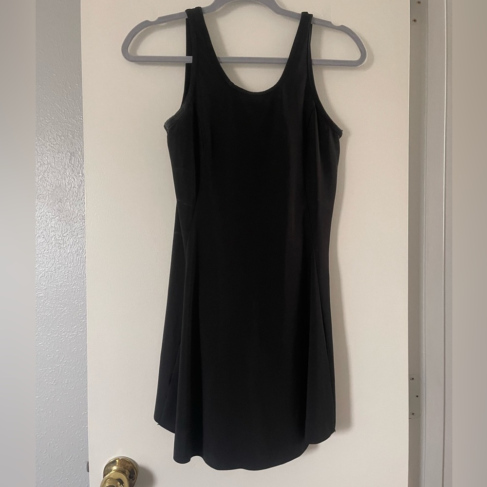 Black athletic dress shorts underneath